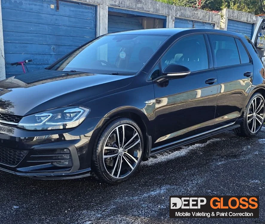 Glossy black Volkswagen Golf valeted by Deep Gloss Valeting, with the Deep Gloss logo watermark